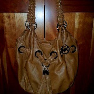 Never used authenic  brown leather Micheal Kors large purse.